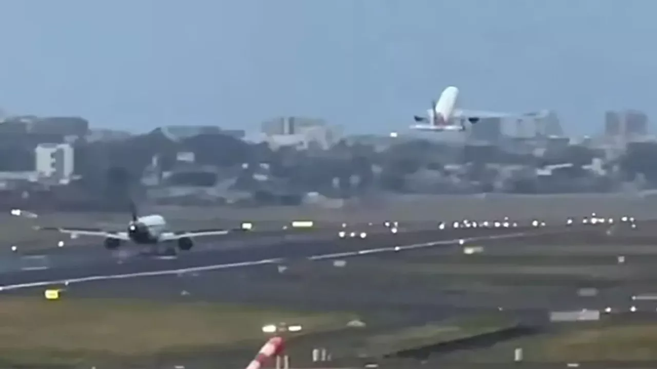 Terrifying moment passenger plane lands just metres behind another at Mumbai airport in heart-stopping...