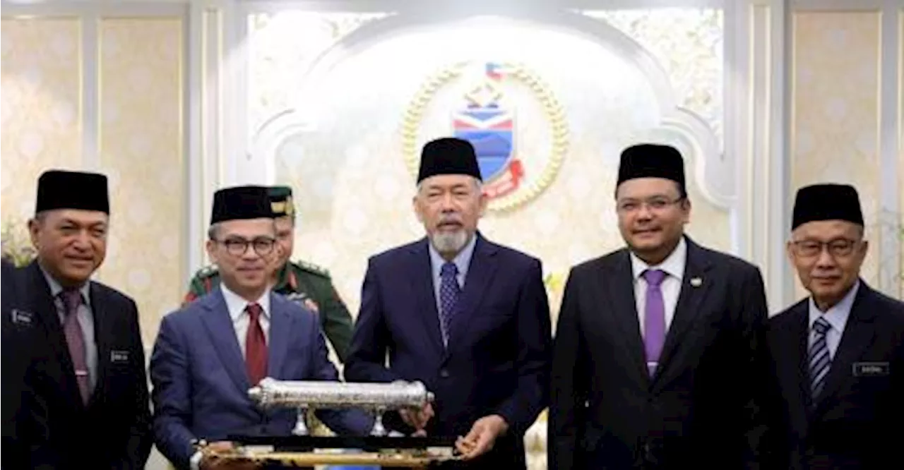 Fahmi presents instrument of royal invitation to Sabah governor for King’s Coronation