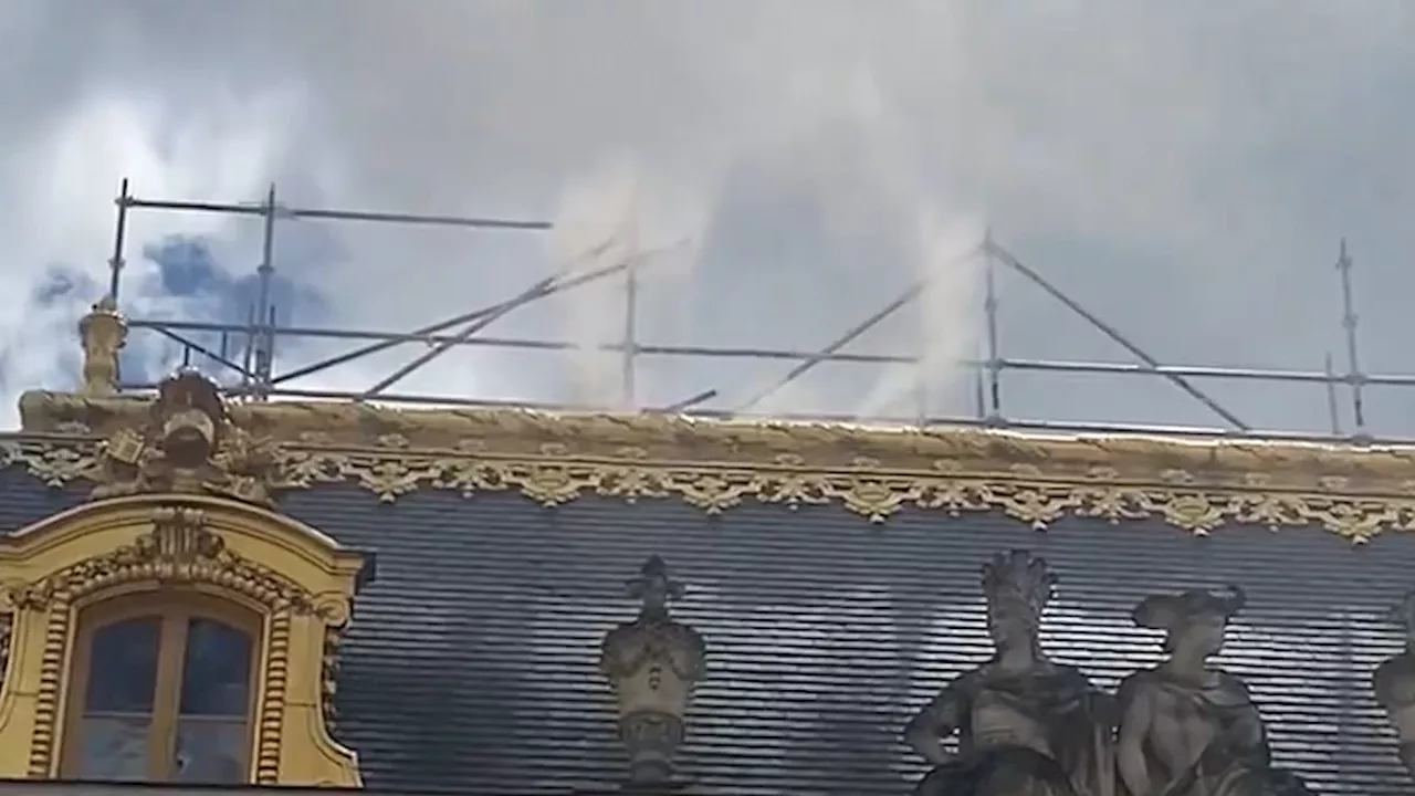 Tourists are evacuated from Palace of Versailles as fire breaks out in roof