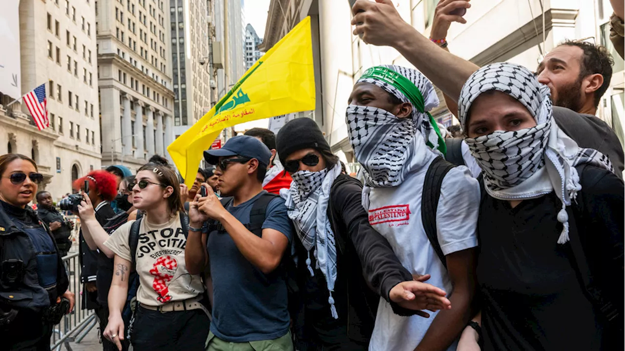 Anti-Israel protesters wave terrorist flag, light flares outside Oct. 7 memorial in NYC