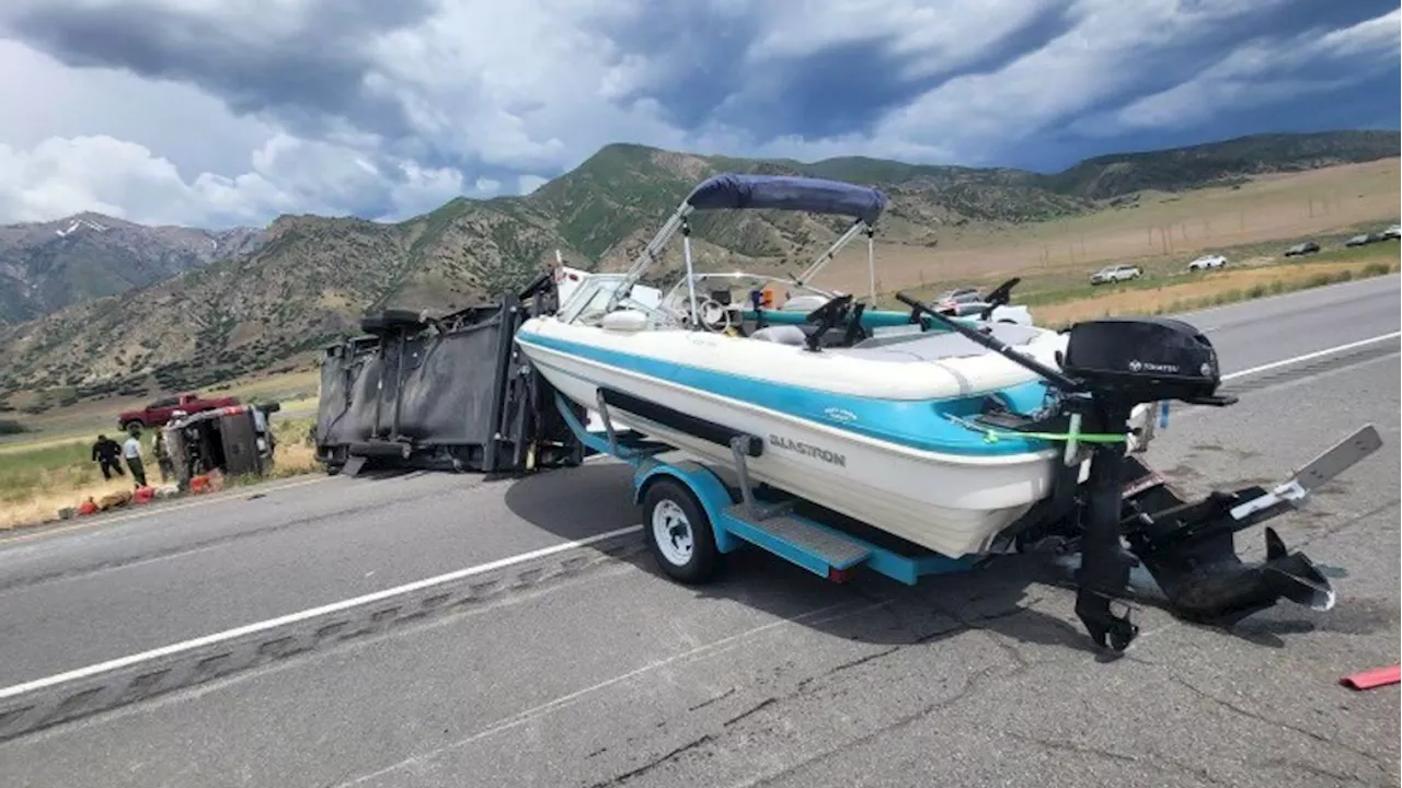 Southbound I-15 closed in Juab County after truck hauling RV, boat rolls over