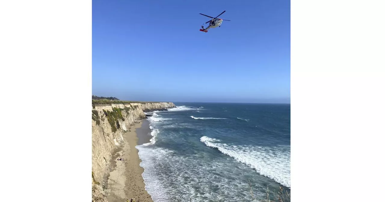 Kite surfer rescued from remote California beach rescued after making 'HELP' sign with rocks