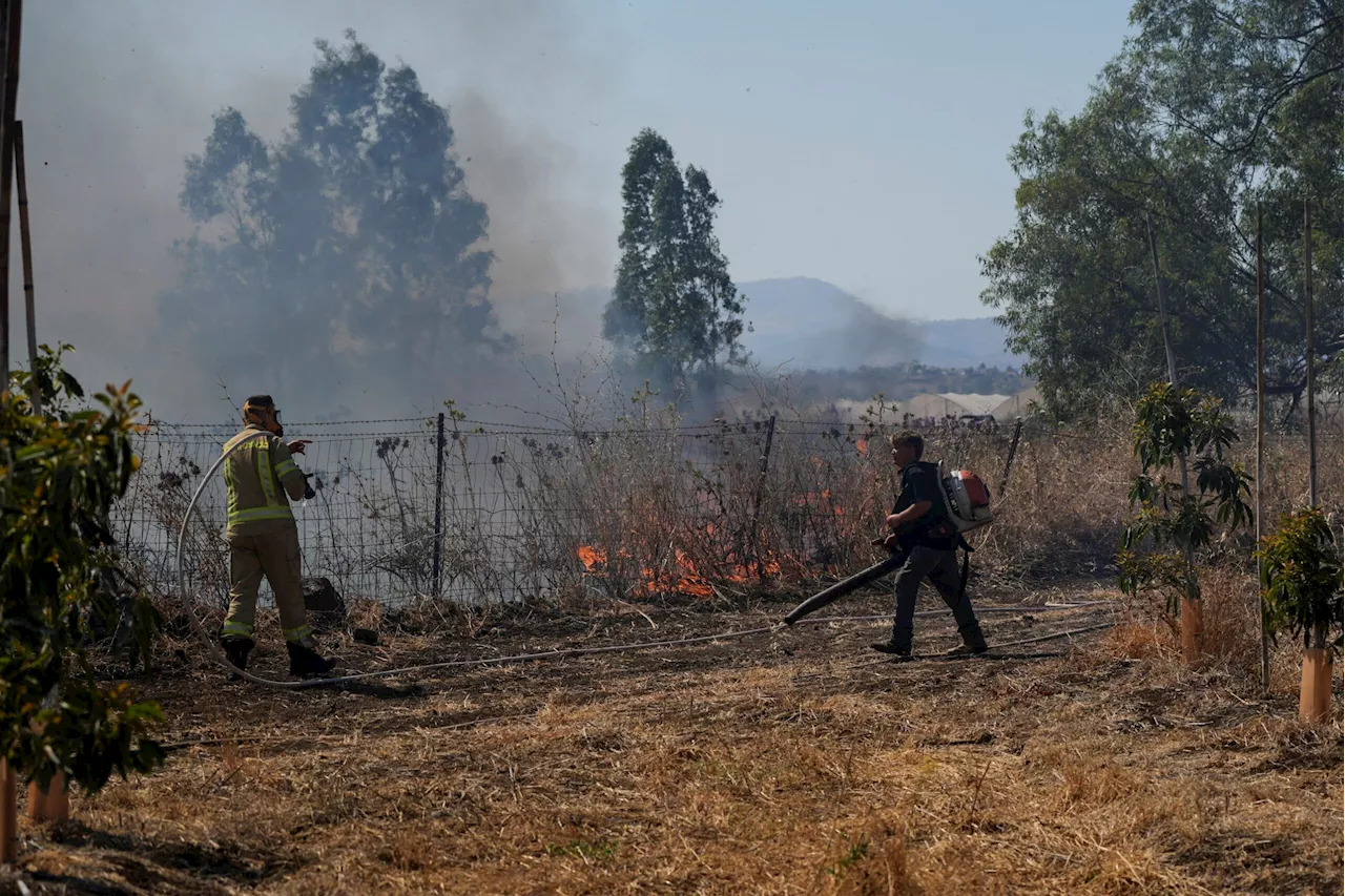 Hezbollah fires big rocket salvos at Israel after senior commander killed