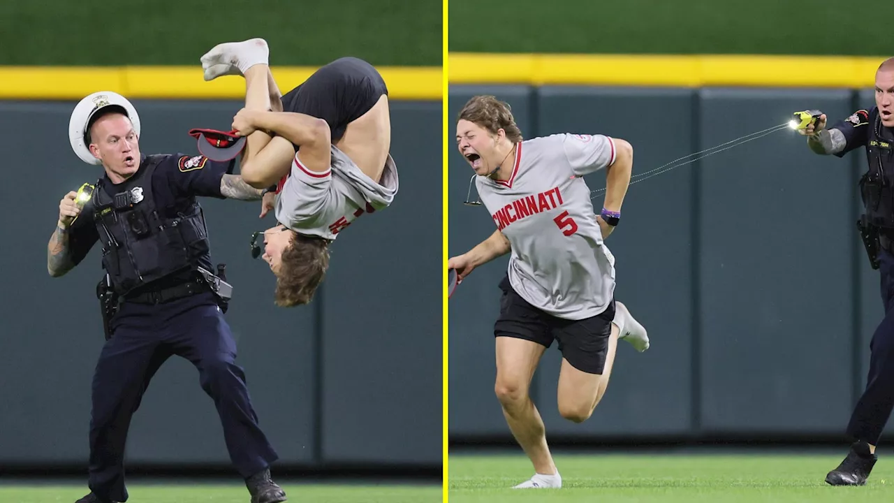 Crazy scenes as baseball fan rushes onto field, does a perfect backflip, and sees fun run ended when he’s t...