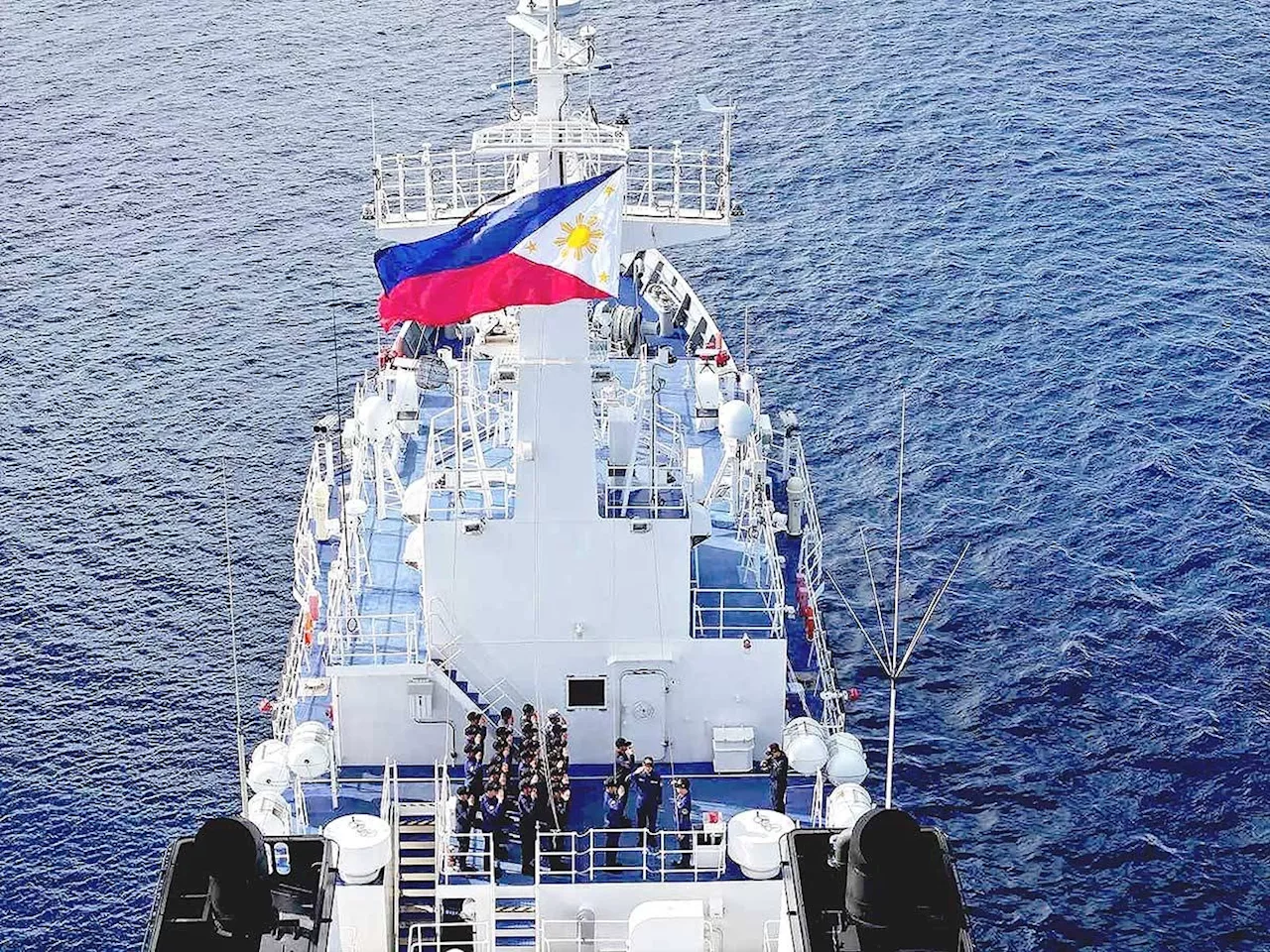 PCG men raise PH flag over Escoda Shoal