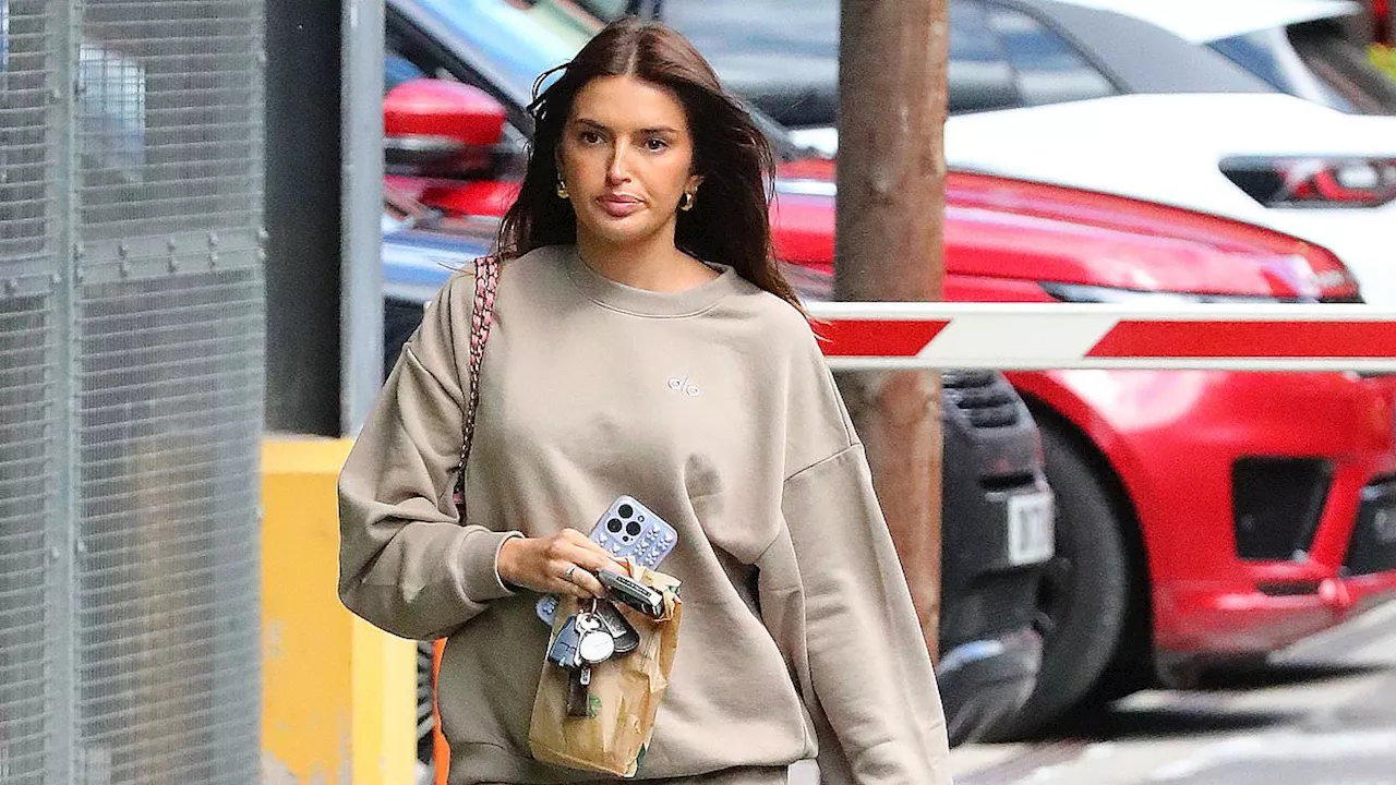 Sasha Attwood cuts a casual figure in a beige tracksuit as she steps out solo in Cheshire while...