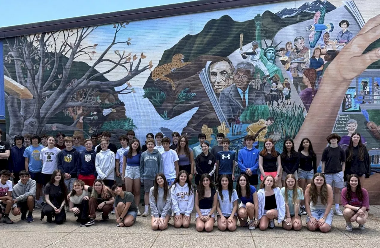 Double take: 23 sets of twins graduate from a single Massachusetts middle school