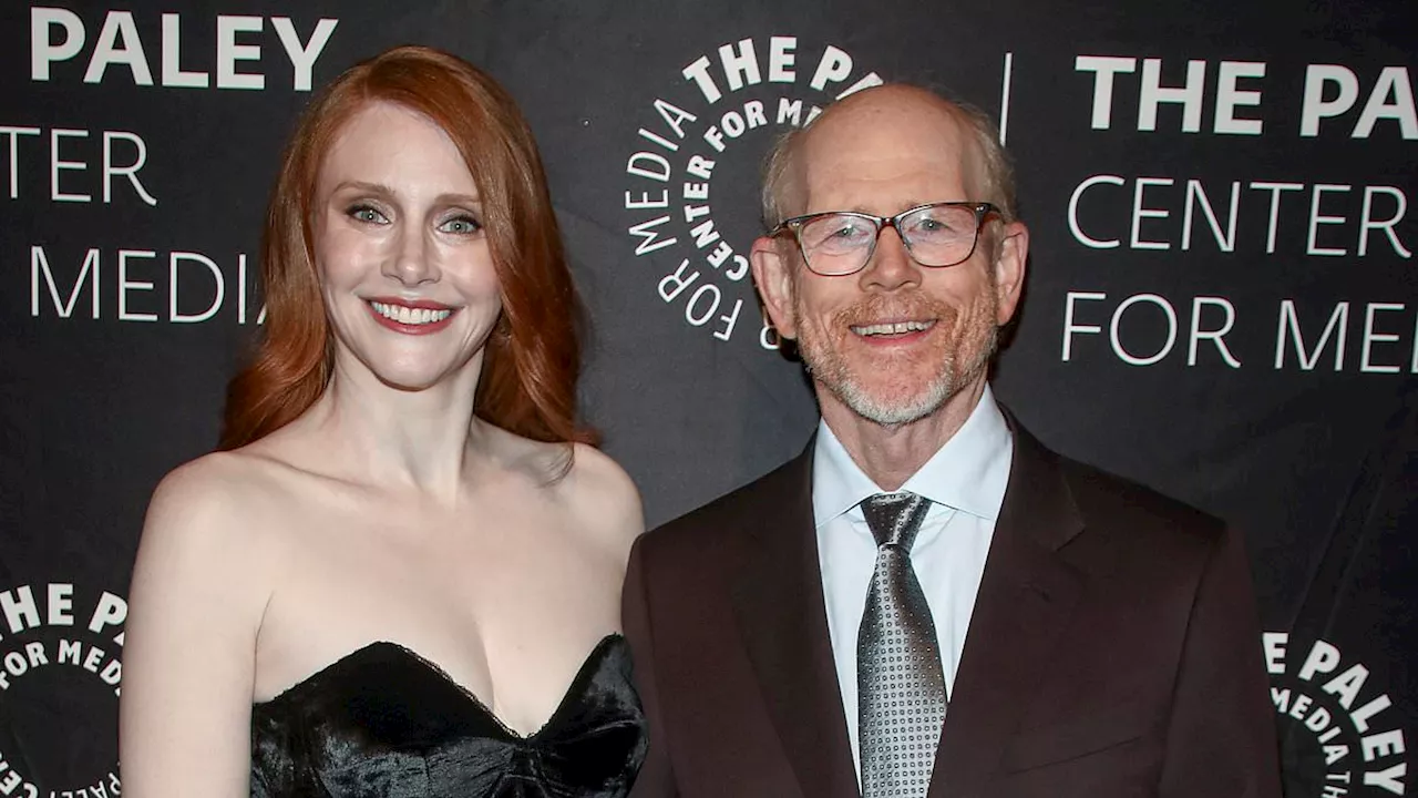 Bryce Dallas Howard dons strapless black velvet dress to support her famous father Ron Howard at...