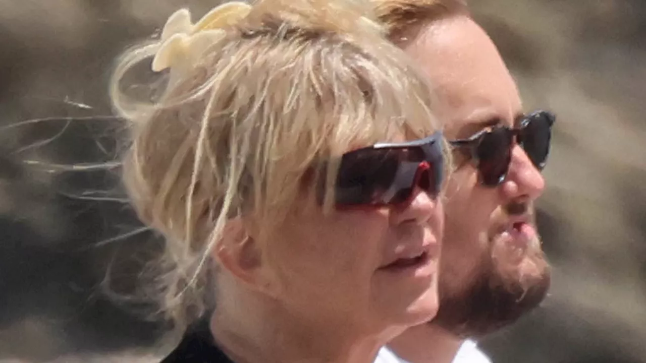 Goldie Hawn, 78, rocks black swimsuit alongside shirtless Kurt Russell, 73, as they hit the beach...