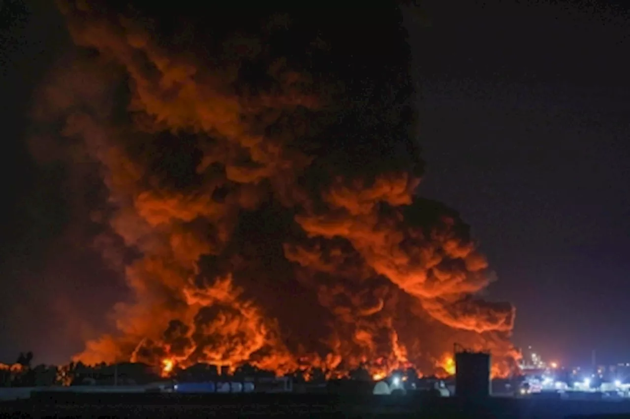 Huge fire at Iraq oil refinery injures 14, burns three fire trucks