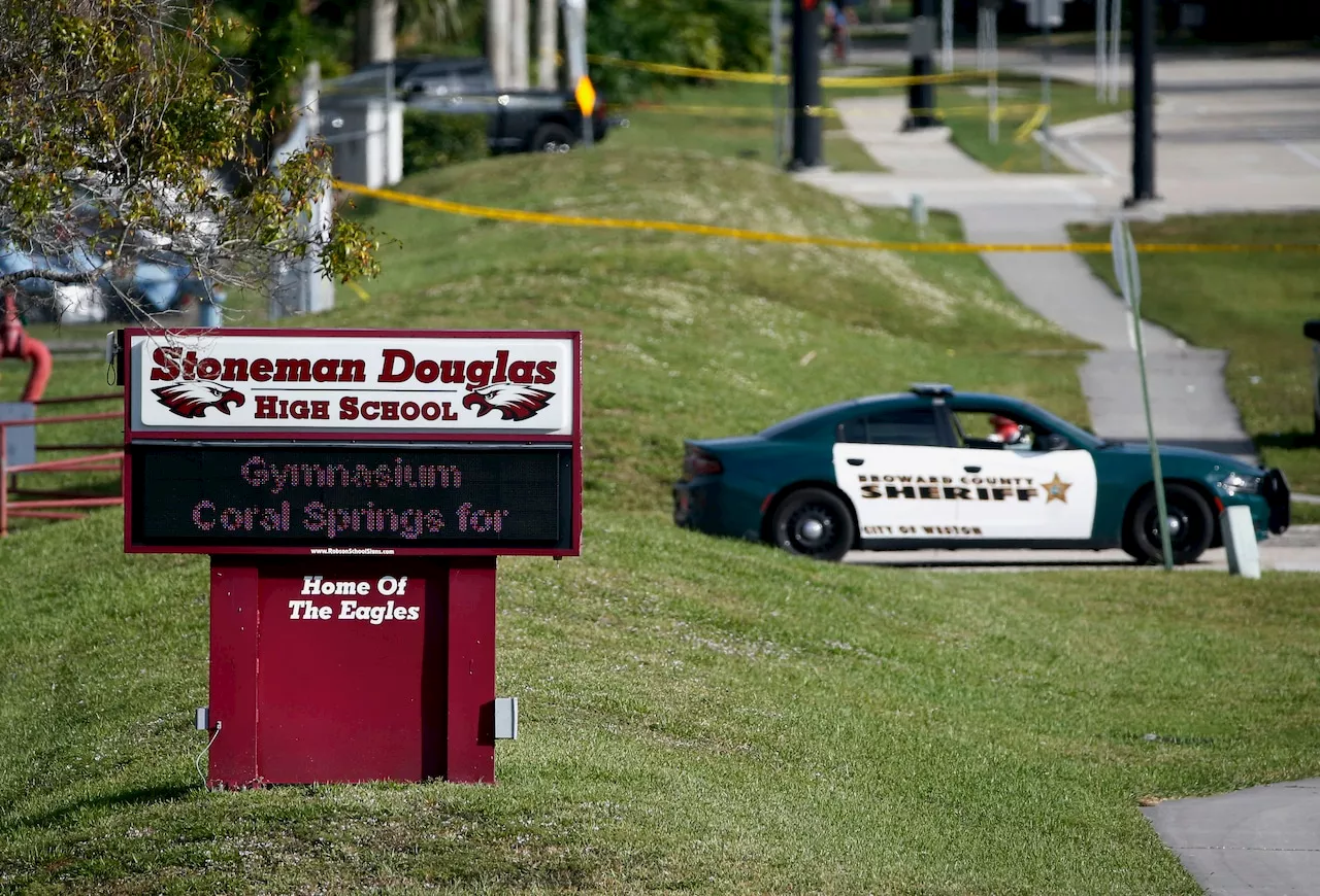 Demolition begins on high school where 17 people were shot to death