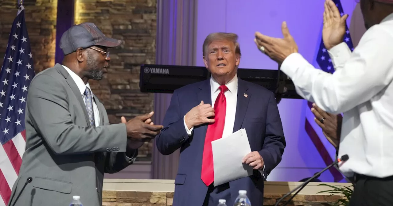 Trump visits a Black church during swing through Michigan