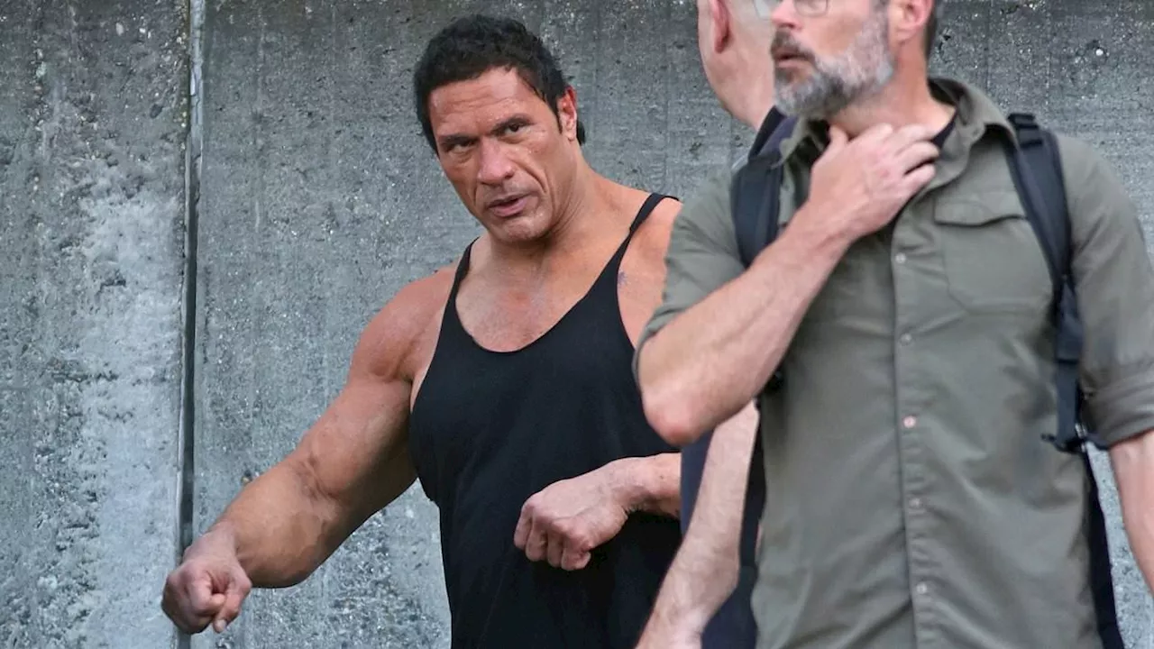 Dwayne Johnson shows off his buff physique in a tiny pair of shorts on set of his film The Smashing...