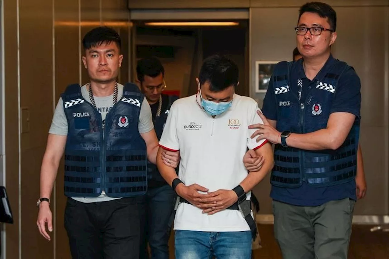 Two men extradited from Malaysia for alleged involvement in malware scams against Singaporeans