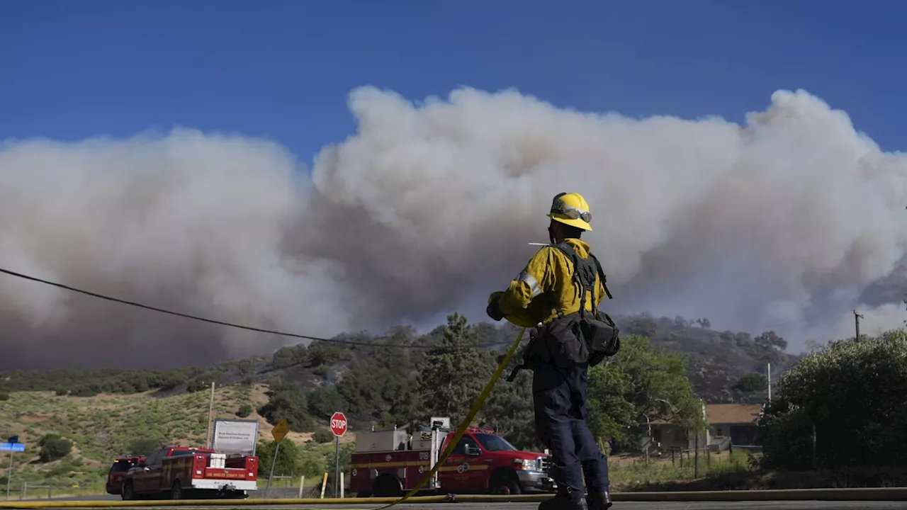 Wildfire north of Los Angeles spreads as authorities issue evacuation orders