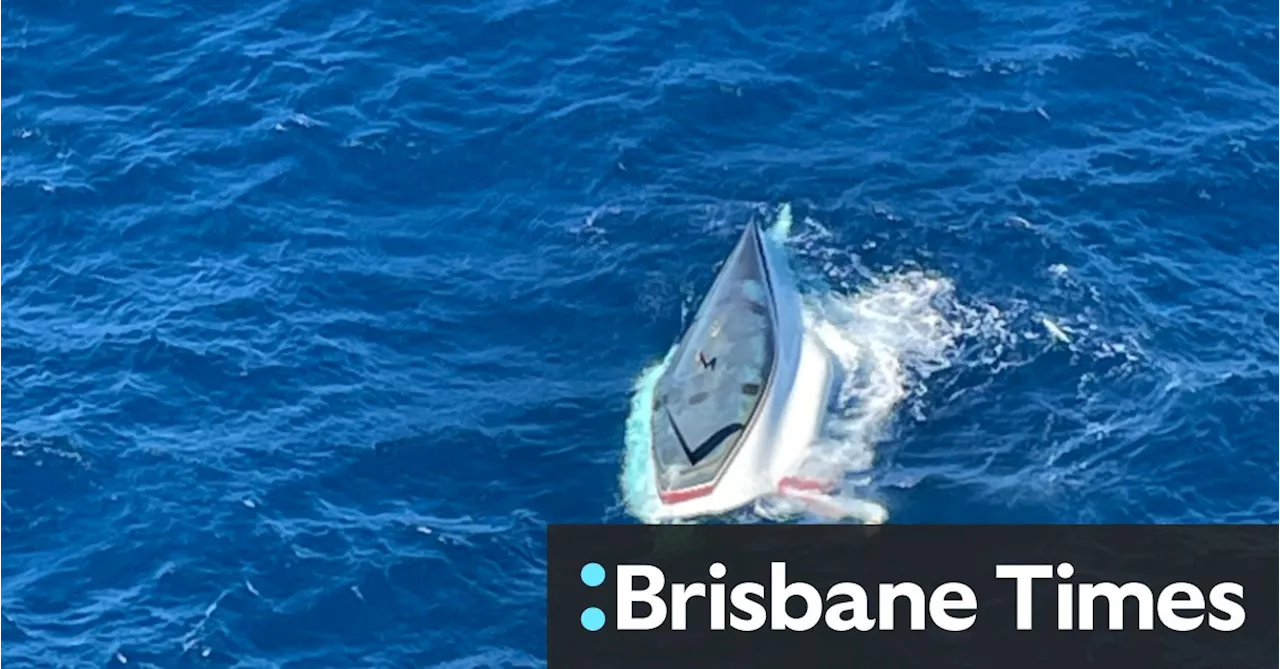 One dead, father and son rescued after yacht capsizes off Queensland coast