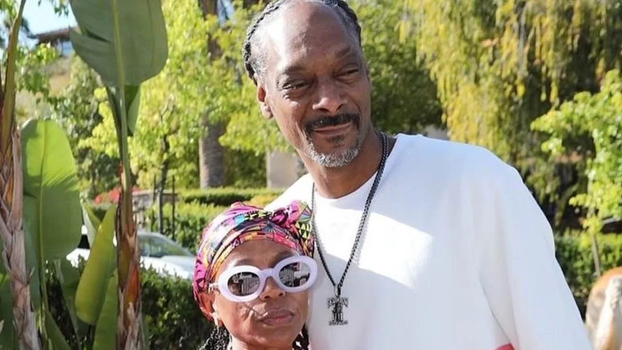 Snoop Dogg matches in pink with his high school sweetheart Shante Broadus as they celebrate 27 years...