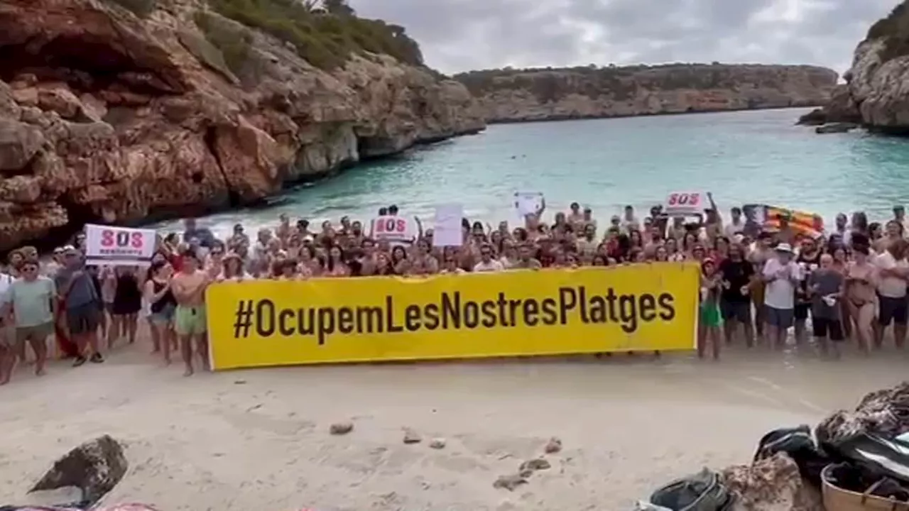 Majorcans take over tiny cove amid island's anti-tourism backlash