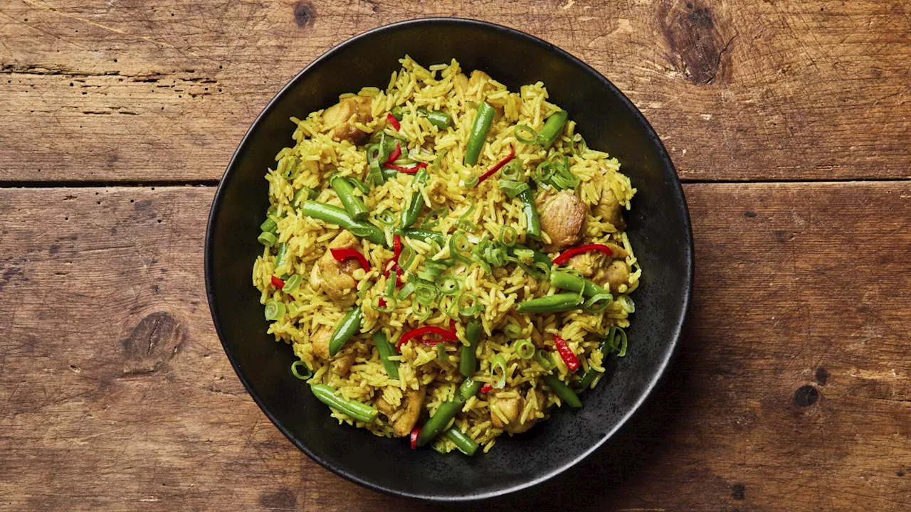 Leftover rice gets a new life in this Nigerian-inspired curried skillet meal