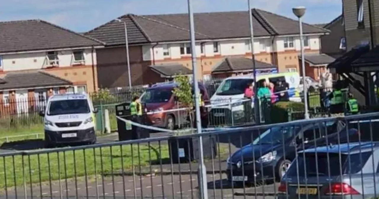 Men 'with weapons seen on street' taped off as man injured and another arrested