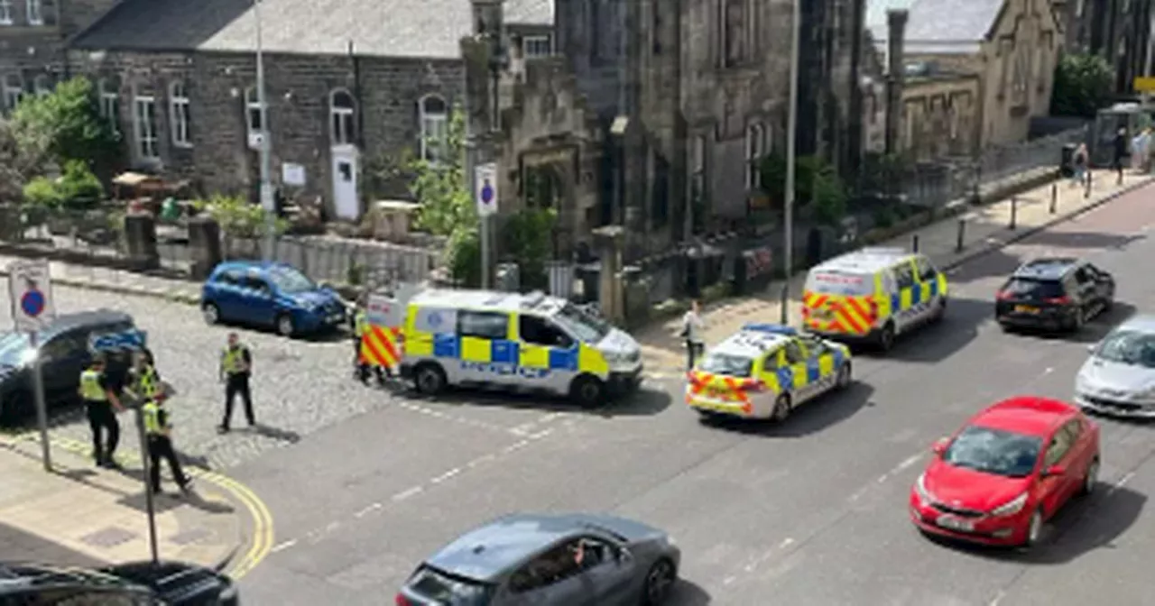 Police rush to busy Edinburgh street as it 'kicks off' close to funeral parlour