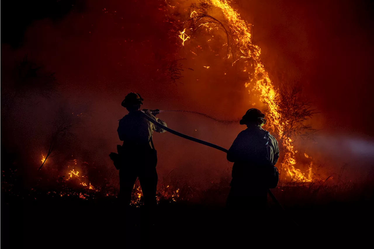 Crews working in sweltering conditions and steep terrain battle major Los Angeles-area wildfire