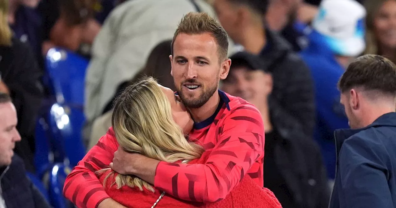 Harry Kane's wife Kate Goodland hugs him in the stands after England Euro opener