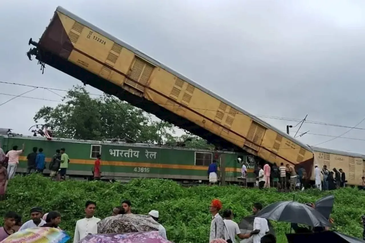 At least 8 dead & 25 injured in horror train pile-up leaving one carriage jammed vertically into the air...