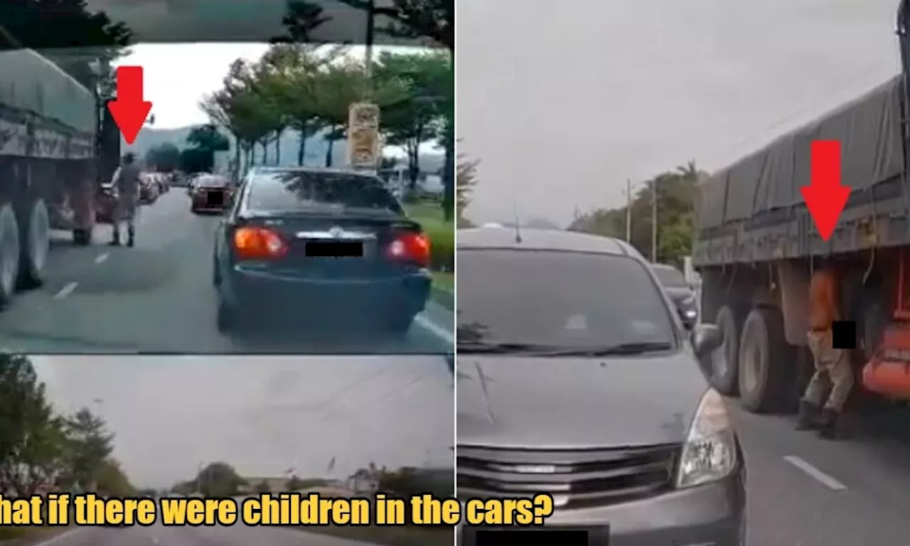 Shirtless Lorry Driver Runs Red Light & Then Pees Publicly in Traffic Under His Lorry in Ipoh