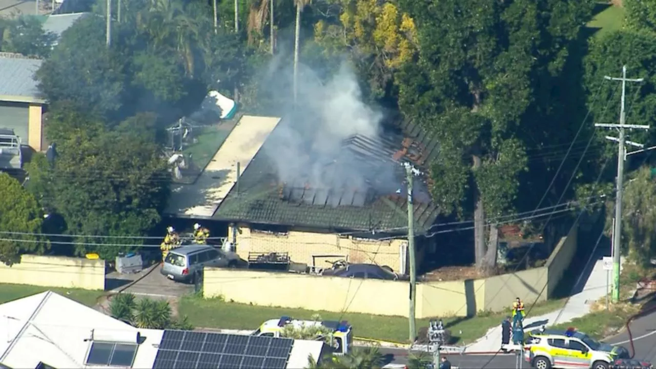 Two people injured, two dogs killed in house fire at Rochedale South in Brisbane