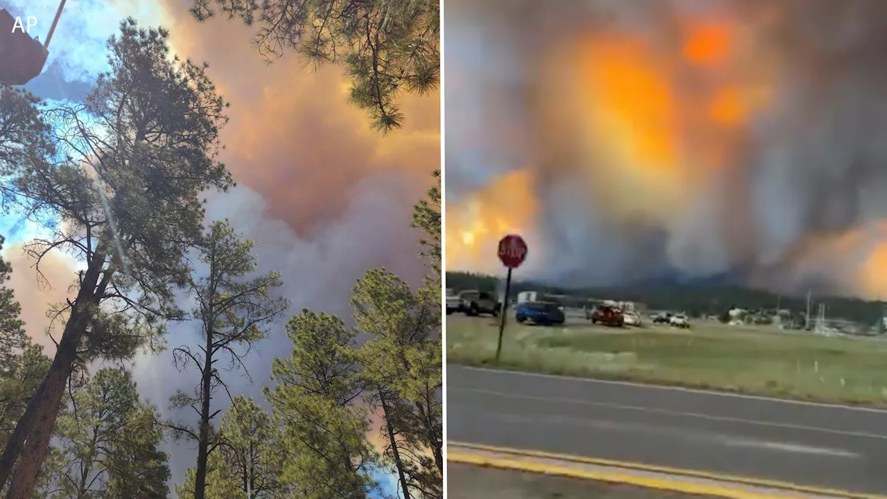 New Mexico governor declares emergency as thousands flee wildfires that have damaged 500 structures