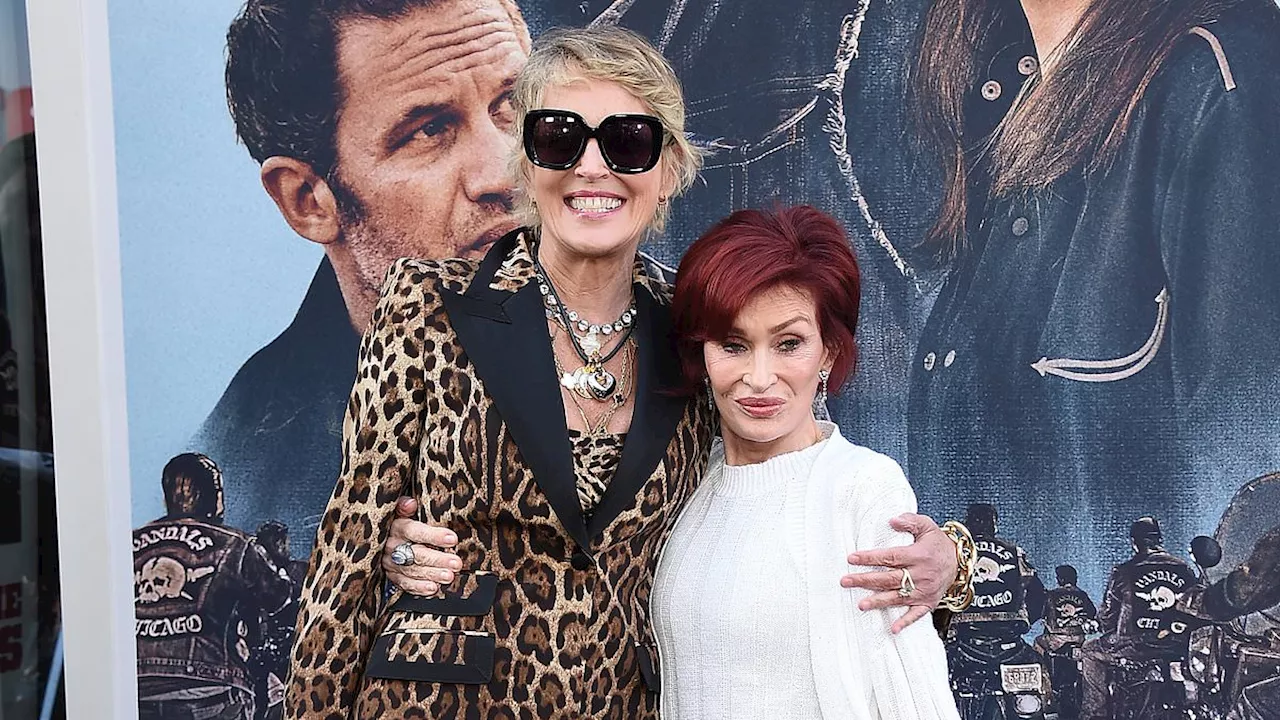 Sharon Stone and Sharon Osbourne wrap their arms around each other on the red carpet at star-studded...