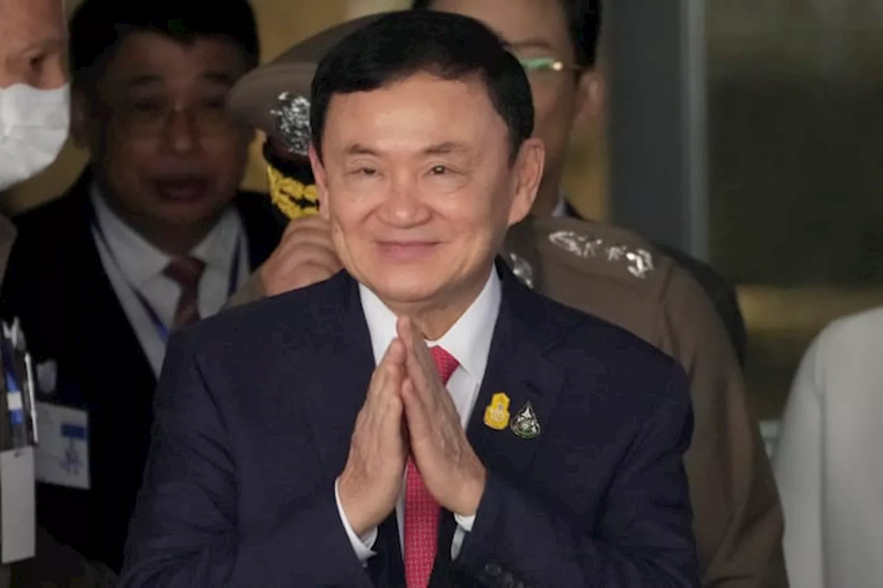 Thaksin indicted on charge of royal defamation as more court cases stir Thailand's political woes