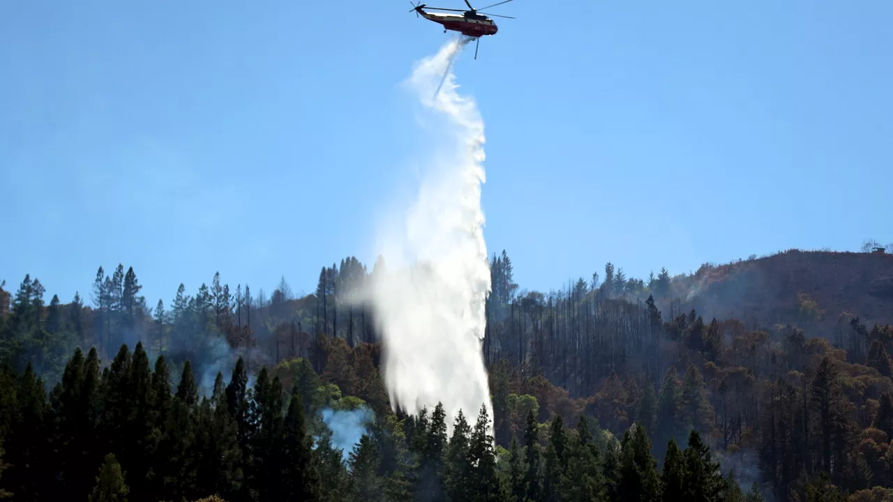 New wildfires grow in Northern California as firefighters gain ground against big blaze in the south