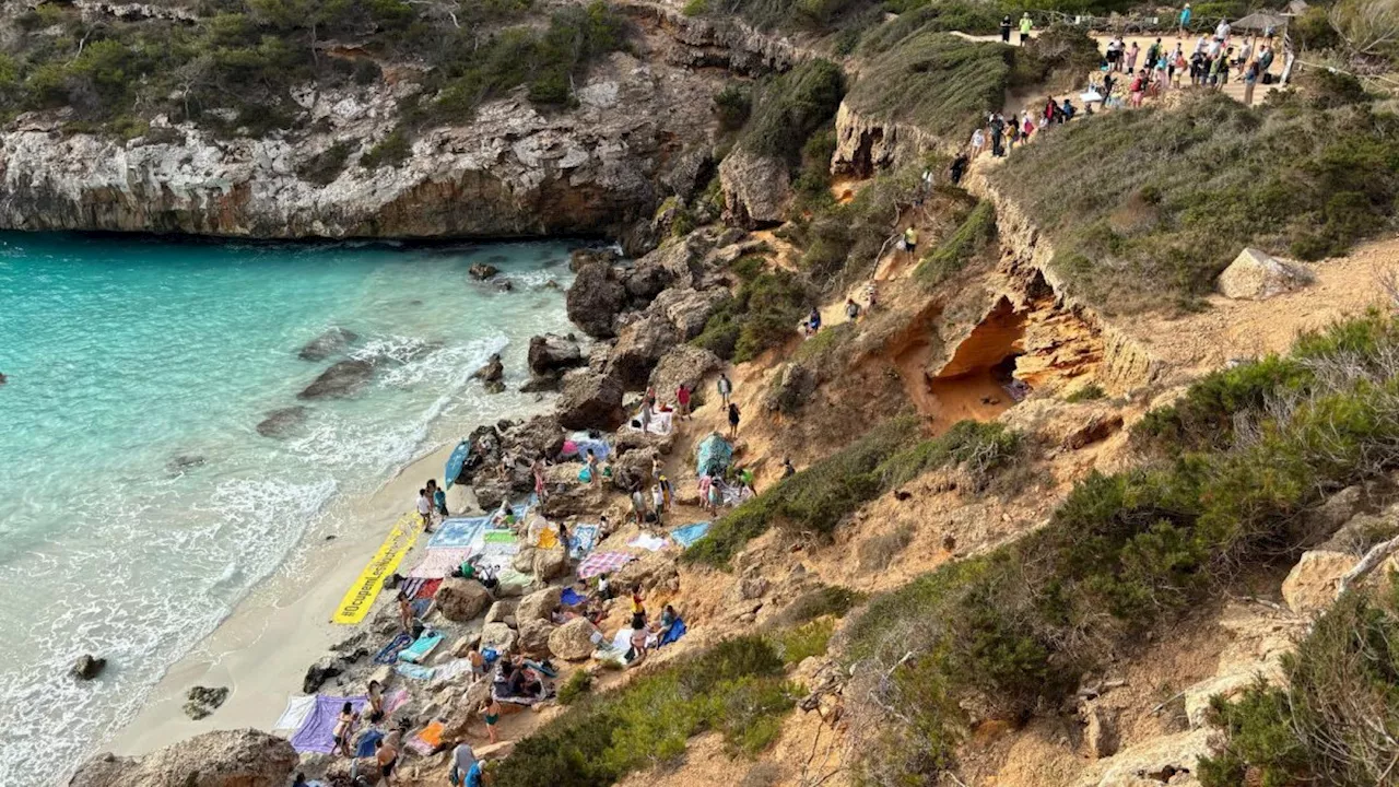 Mallorca protesters jeer and shout at tourists to leave popular beach