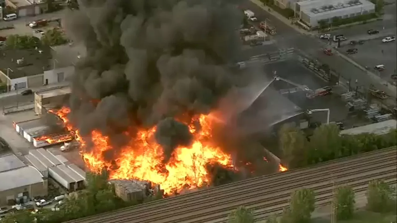 Chicago fire crews battle massive blaze at West Town pallet yard, hazmat situation declared