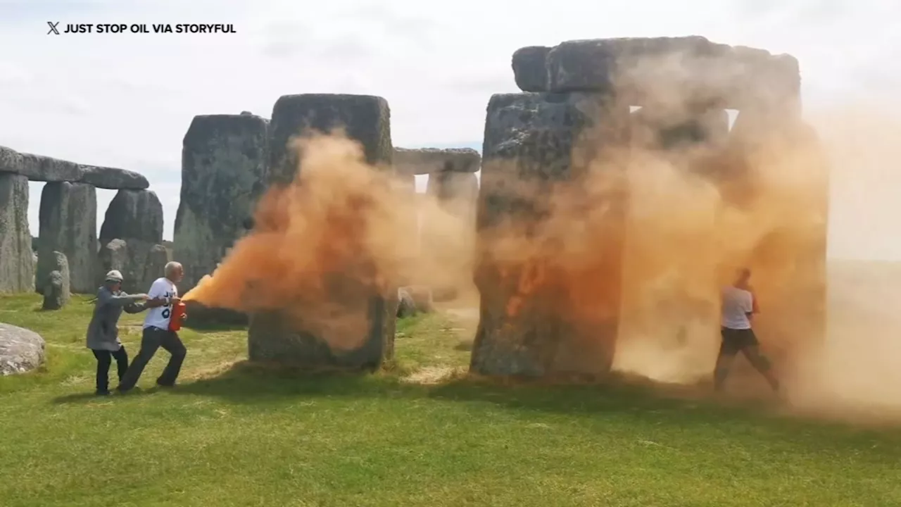 Environmental protesters spray 'orange powder paint' on Britain's Stonehenge