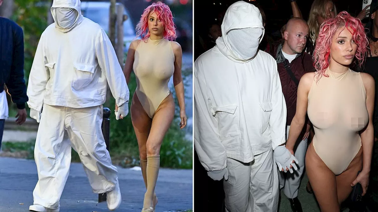 Kanye West's wife Bianca Censori debuts pink hair as she models a sheer nude thong leotard while the...