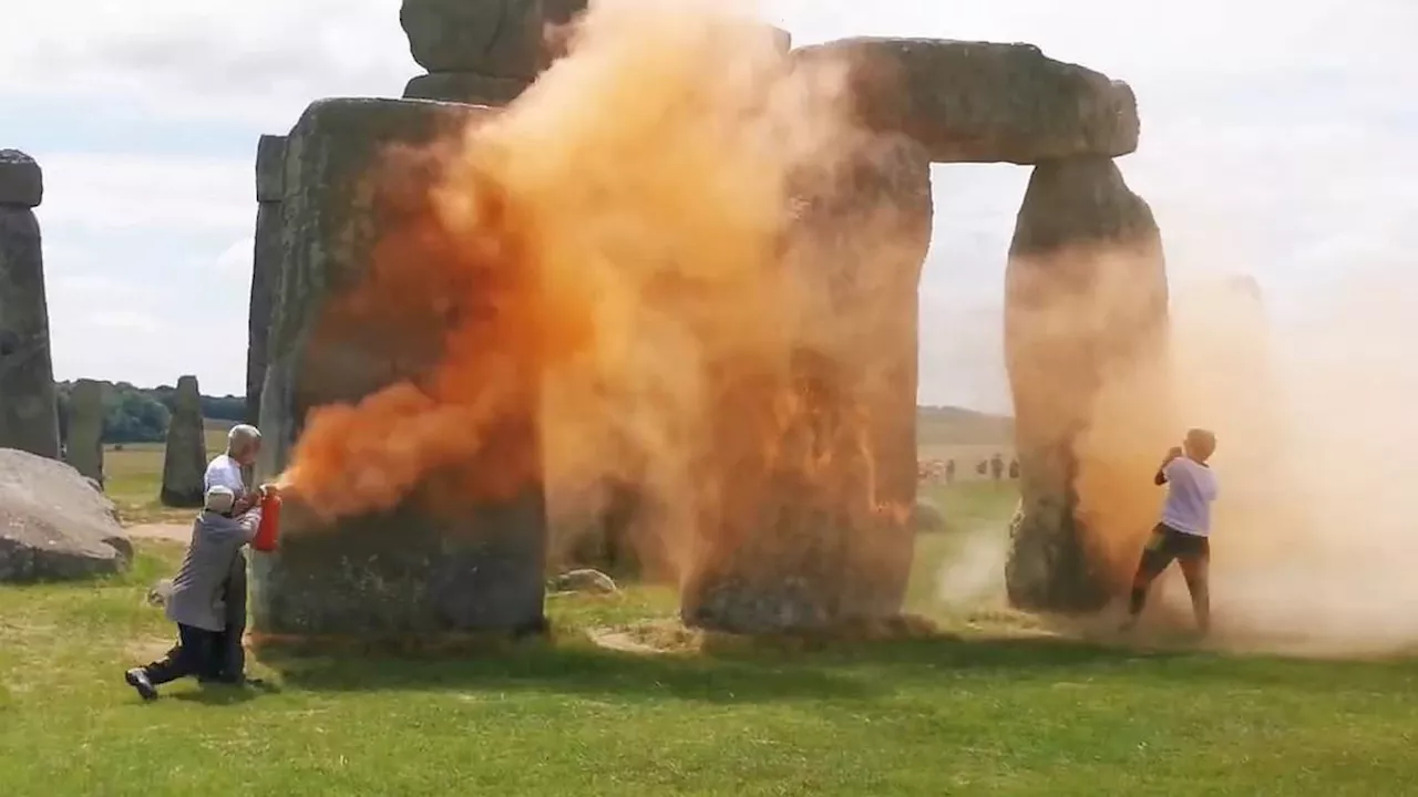 Just Stop Oil spray Stonehenge with orange paint