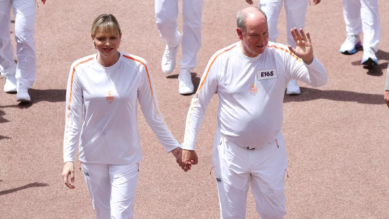 Reunited: Princess Charlene hand in hand with Prince Albert after divorce speculation