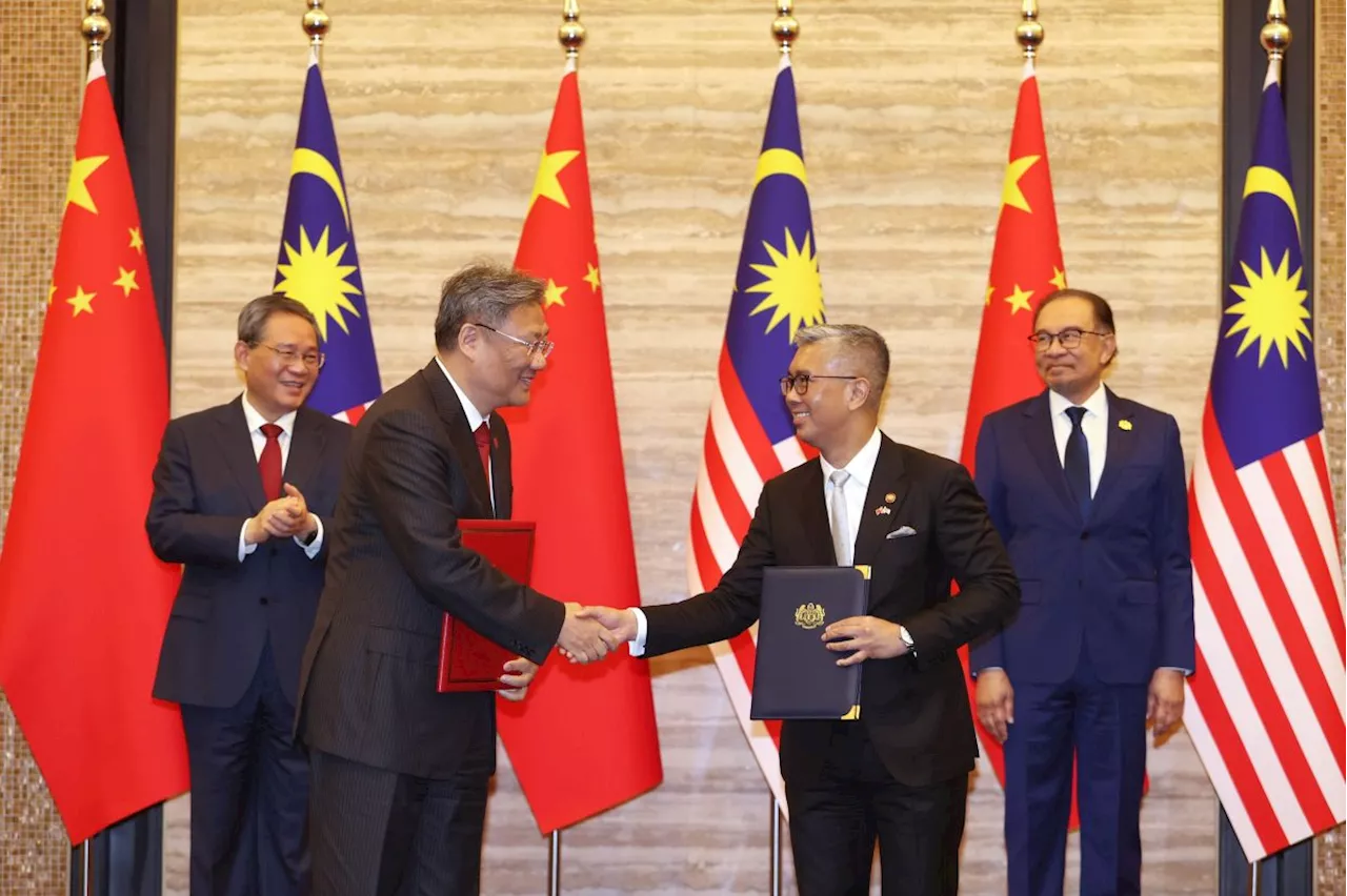 Malaysia and China ink 14 MOUs