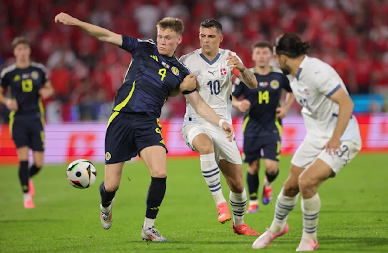 Scotland boost hopes of making it through the group stage with Switzerland draw