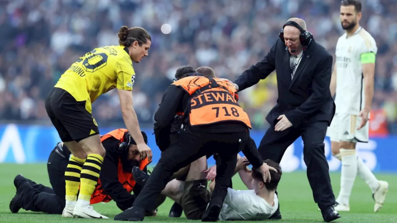 Champions League final marred as three arrests made over pitch invasion