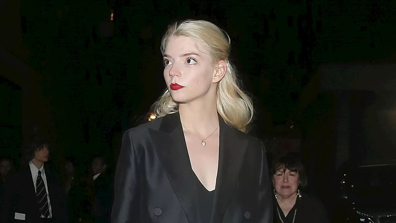 Anya Taylor-Joy dons a sleek black dress as she joins Cara Delevingne and girlfriend Minke for a...