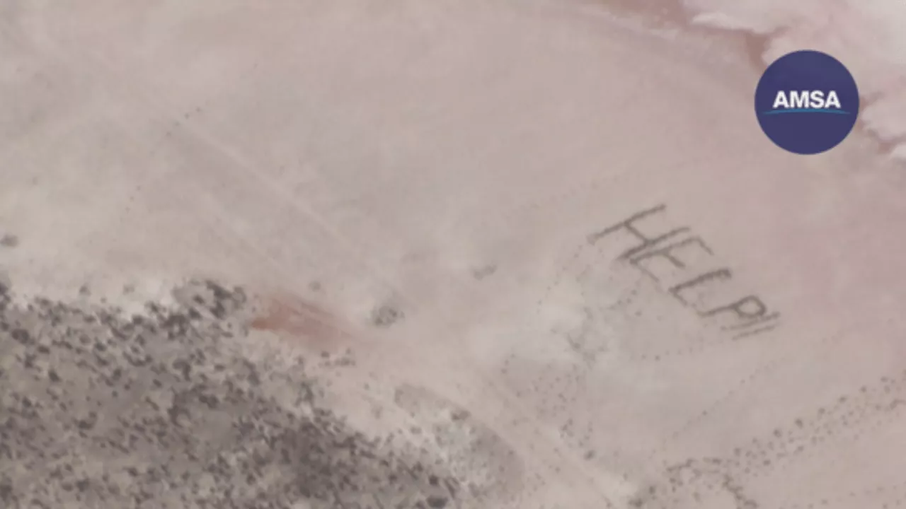 Stranded teens send ‘HELP’ message in sand