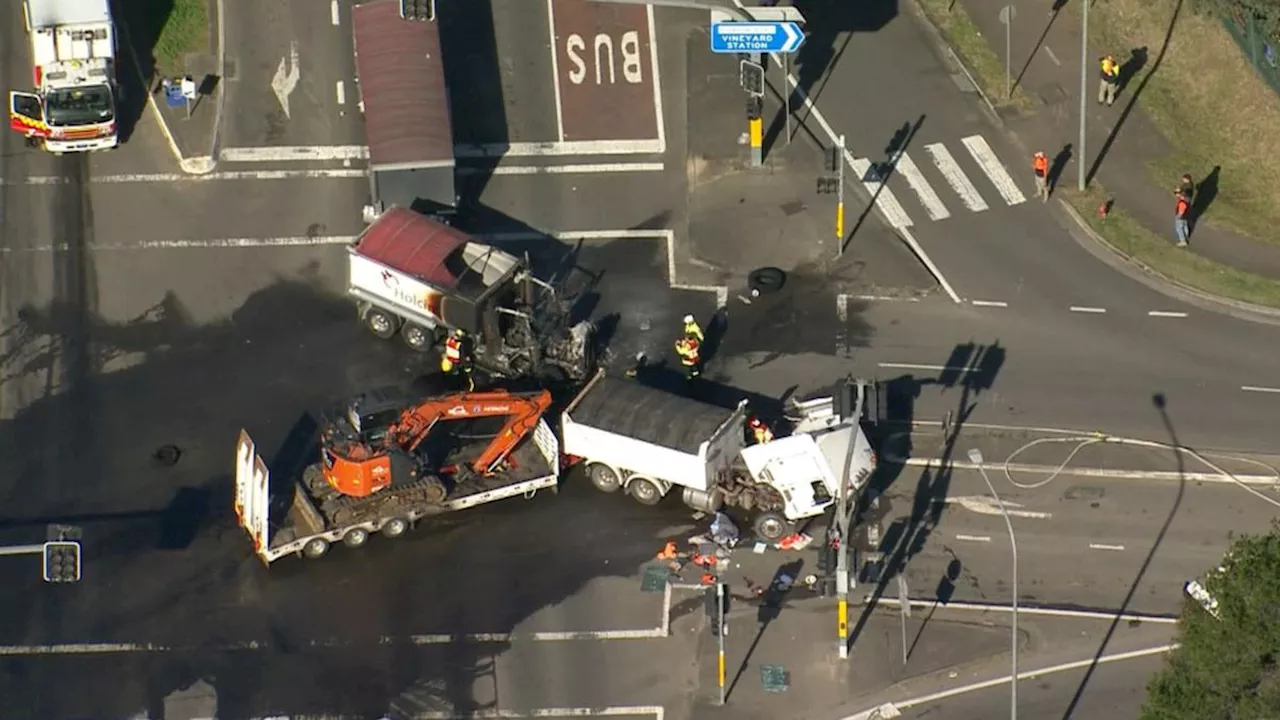 Two people hospitalised after trucks collide in fiery crash at Vineyard in Sydney’s northwest