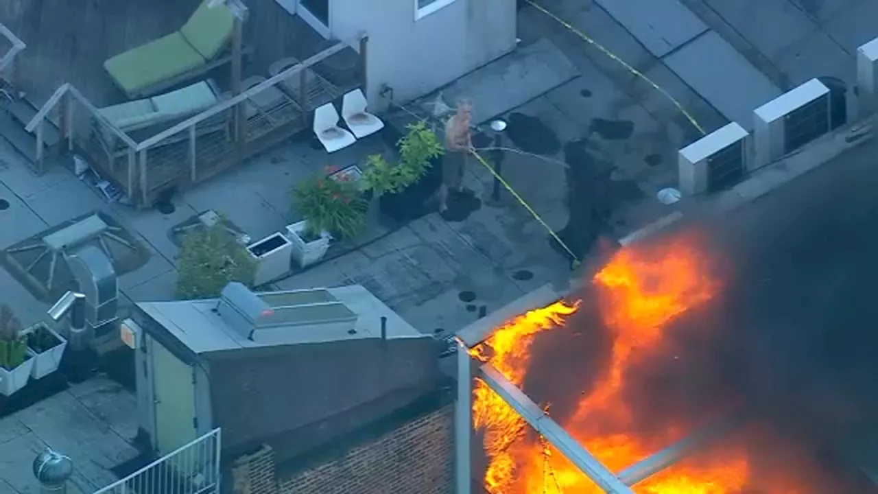 3-alarm fire burns SoHo rooftop as neighbor tries to help firefighters with garden hose