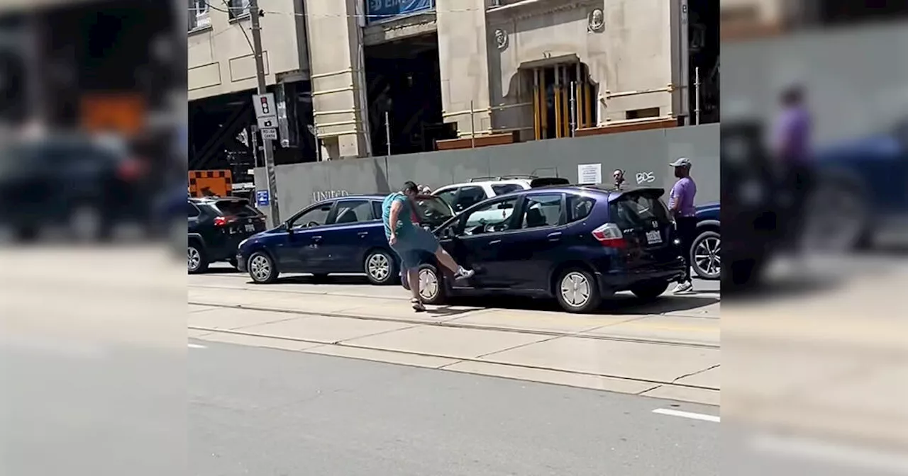 Video shows man kicking car and ripping off its mirror in Toronto road rage incident