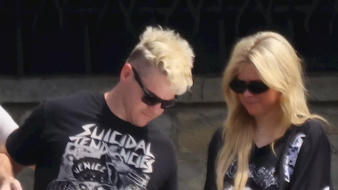 Avril Lavigne debuts NEW romance as she passionately kisses mystery man in Lake Como