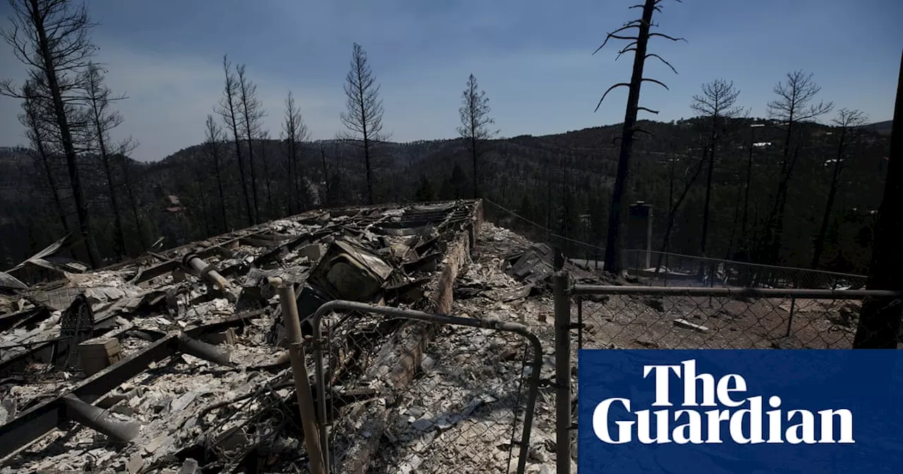 Two killed in New Mexico wildfires as heavy rain offers hope of relief